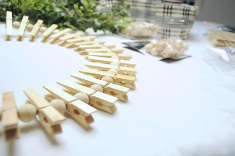 Clothespins in a circular form on a white table